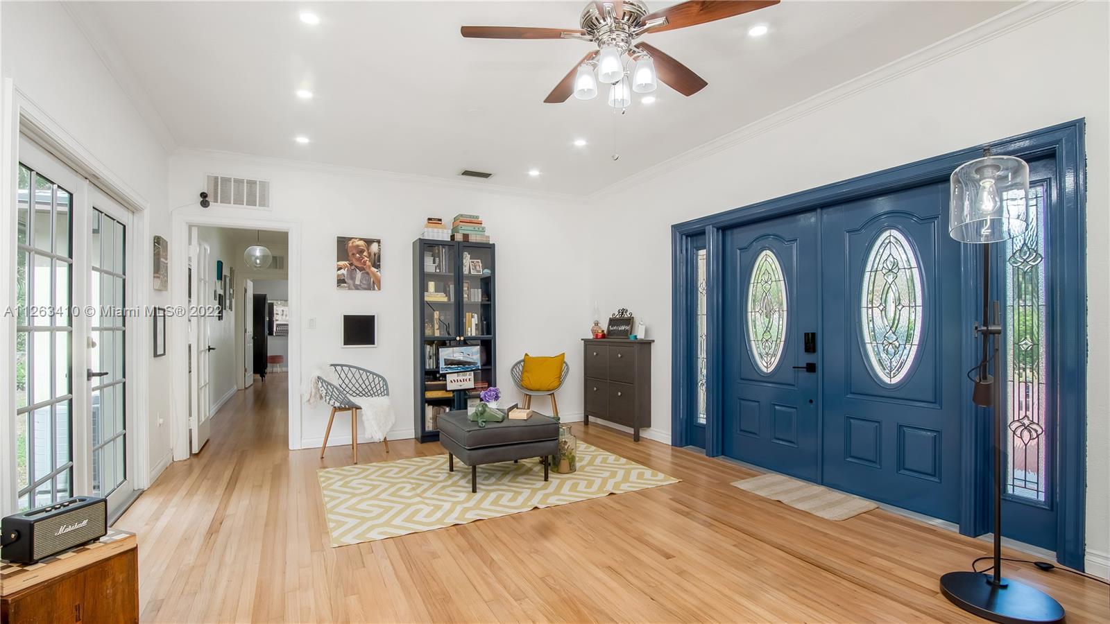 635 Bird Road Coral Gables, FL 33146 - Photo 7 of 35 a living room with furniture a wooden floor and potted plant