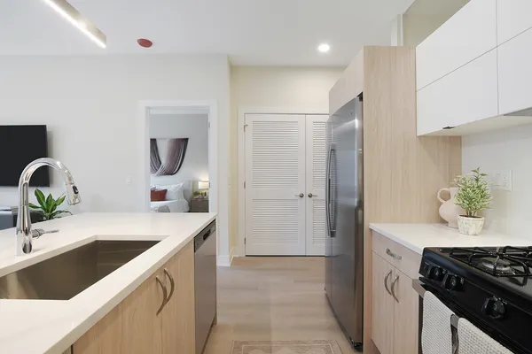 a kitchen with a sink and a stove top oven