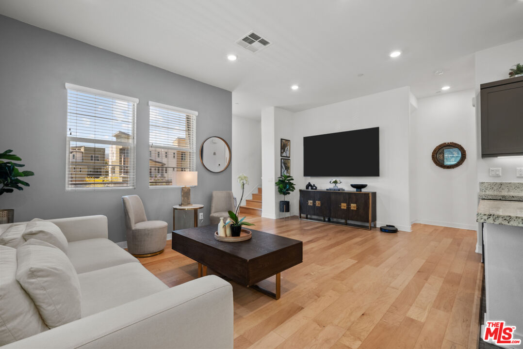 27034 Hummingbird Lane Valencia, CA 91381 - Photo 4 of 24 a living room with furniture and a flat screen tv