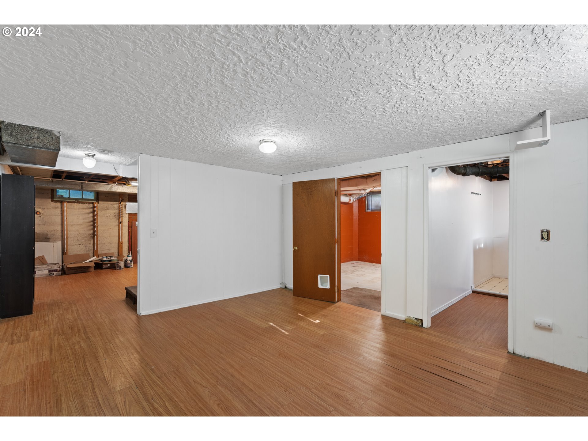4313 Northeast Valley View Lane Vancouver, WA 98663 - Photo 34 of 48 a view of an empty room with wooden floor and a window