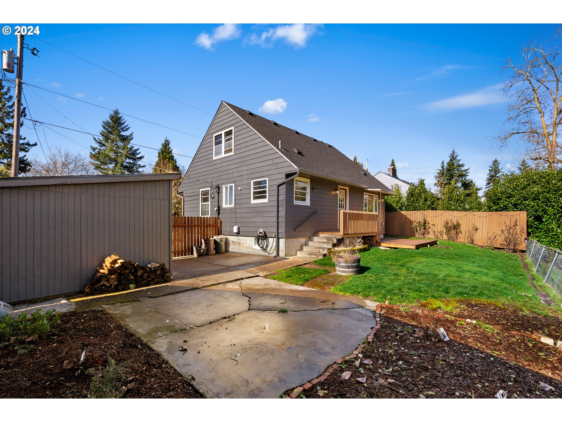 4313 Northeast Valley View Lane Vancouver, WA 98663 - Photo 42 of 48 a backyard of a house with barbeque oven fire pit table and chairs