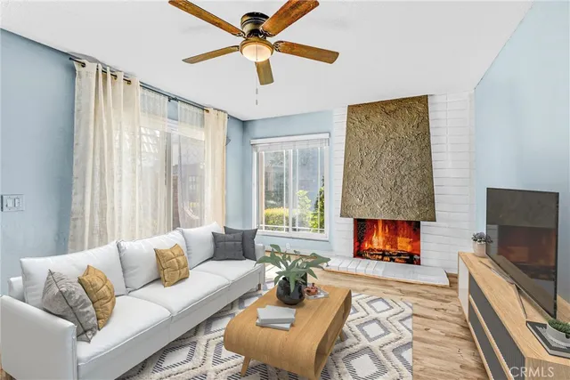 a view of swimming pool with outdoor seating and house in the background
