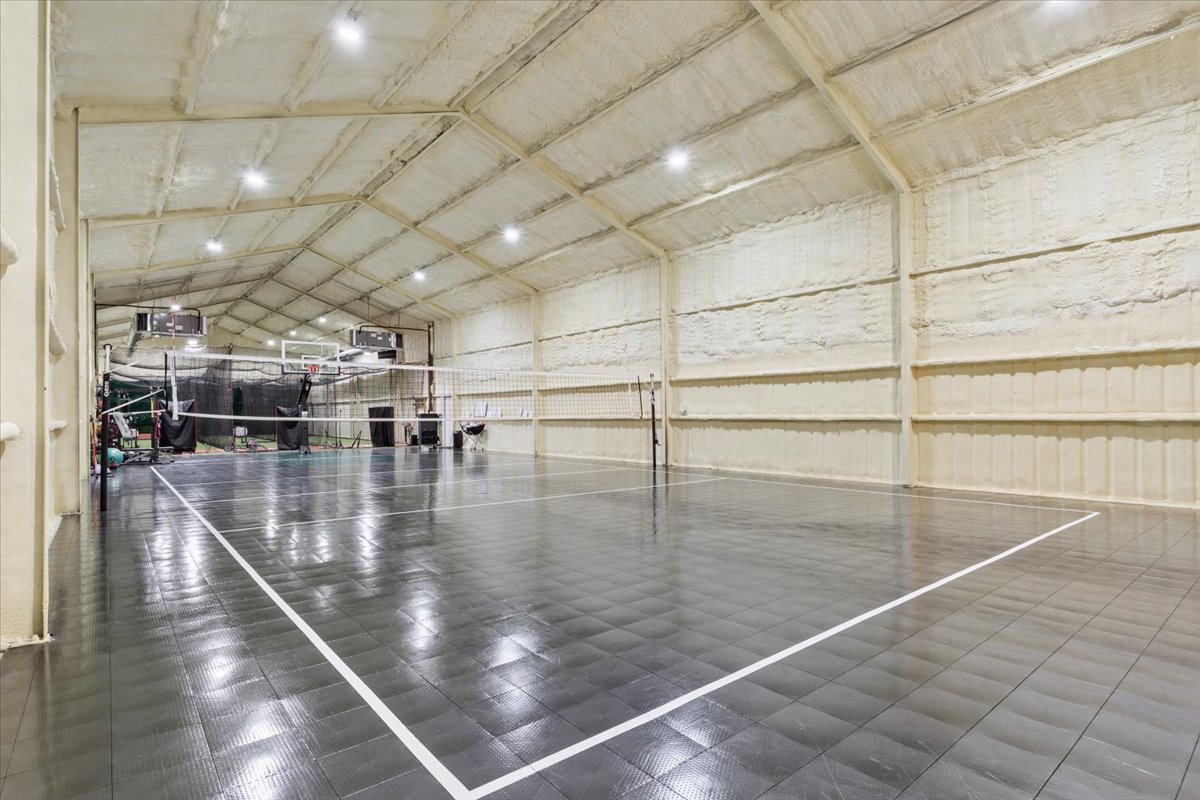 10940 Wedel Cemetery Road Rogers, TX 76569 - Photo 28 of 31 An indoor sports court offers ample space for recreation and athletic pursuits.