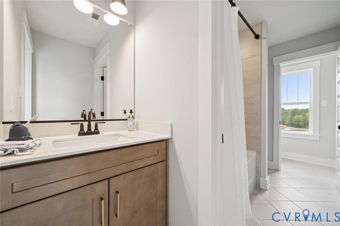 3092 Reed Marsh Drive Goochland, VA 23063 - Photo 14 of 36 a bathroom with a sink and a mirror