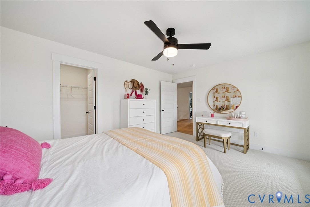 3092 Reed Marsh Drive Goochland, VA 23063 - Photo 18 of 36 a bedroom with a bed and a chandelier