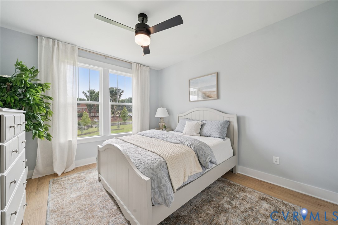 3092 Reed Marsh Drive Goochland, VA 23063 - Photo 20 of 36 a bedroom with a large bed and a window