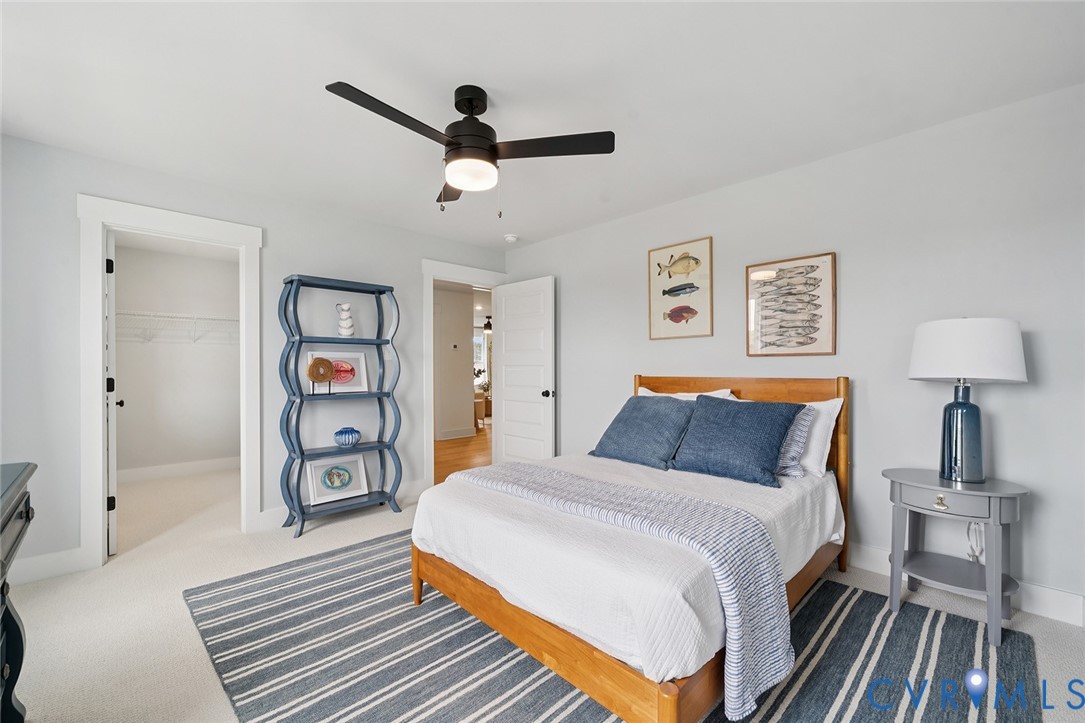 3092 Reed Marsh Drive Goochland, VA 23063 - Photo 22 of 36 a bedroom with a bed and a book shelf