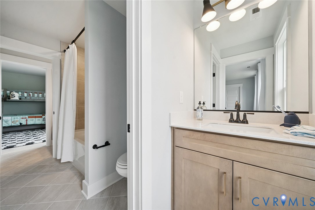 3092 Reed Marsh Drive Goochland, VA 23063 - Photo 23 of 36 a bathroom with a sink and a mirror