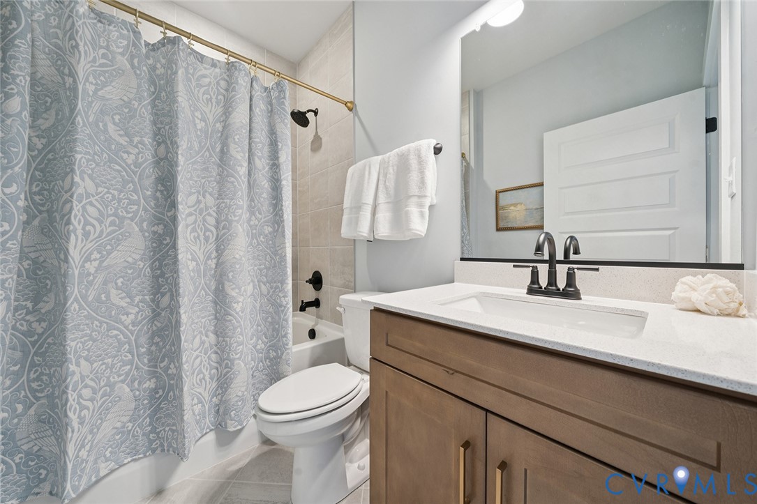 3092 Reed Marsh Drive Goochland, VA 23063 - Photo 24 of 36 a bathroom with a sink a toilet and shower