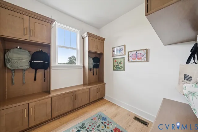 a view of kitchen with furniture and wooden floor