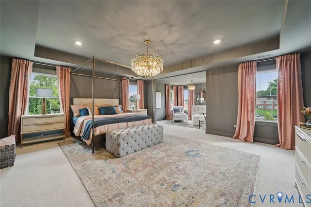 a spacious bedroom with a large bed and a window