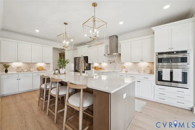 a kitchen with appliances a sink and cabinets