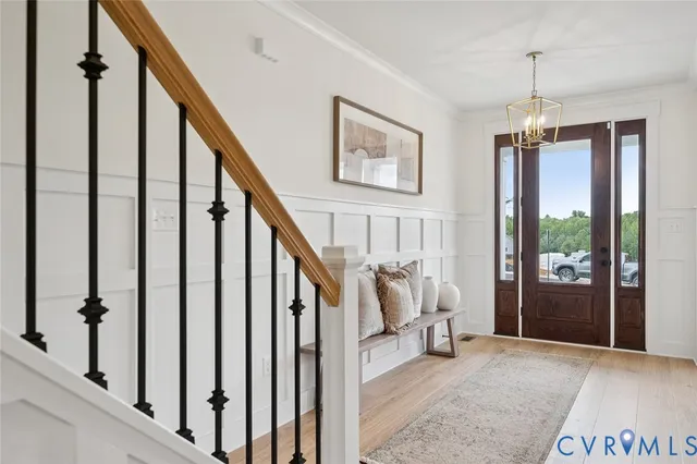 a view of a livingroom with stairs and furniture