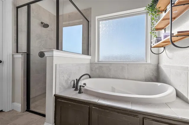 a bathroom with a tub and a sink