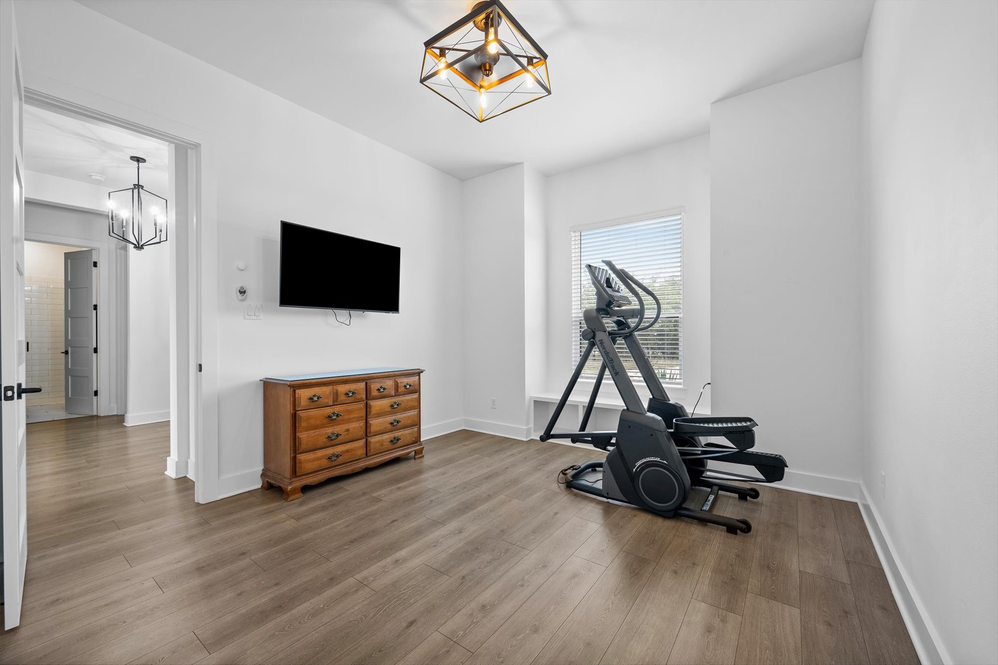 638 Strada Luca Florence, TX 76527 - Photo 28 of 38 A dedicated exercise room boasts durable wood flooring and ample natural light through a generous window.