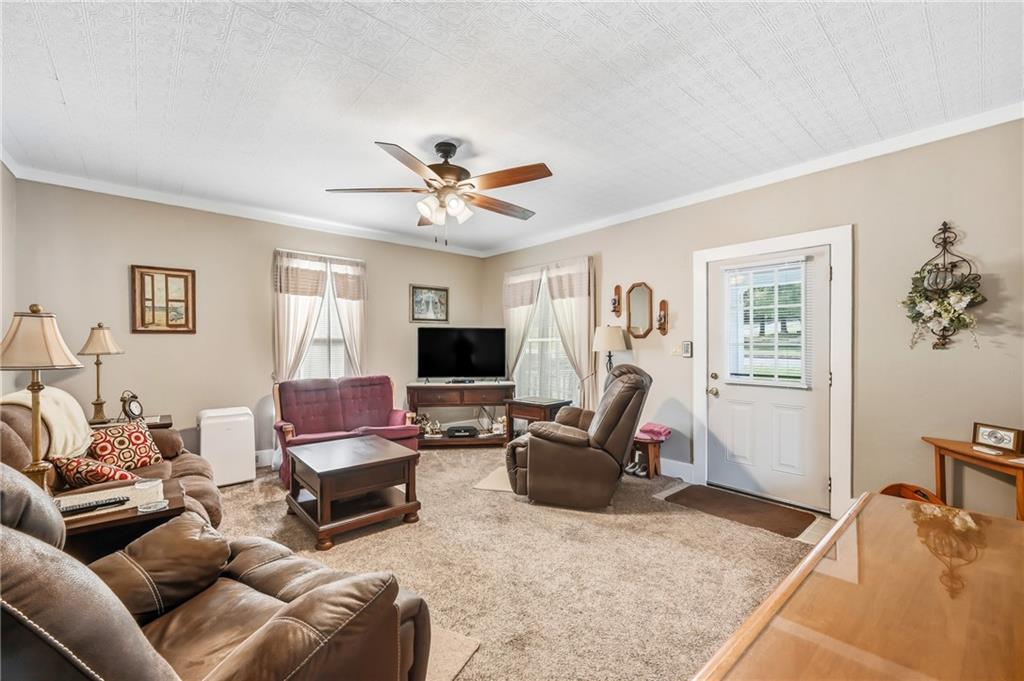 181 West Jamestown Road Greenville, PA 16125 - Photo 20 of 49 a living room with furniture a flat screen tv and a window