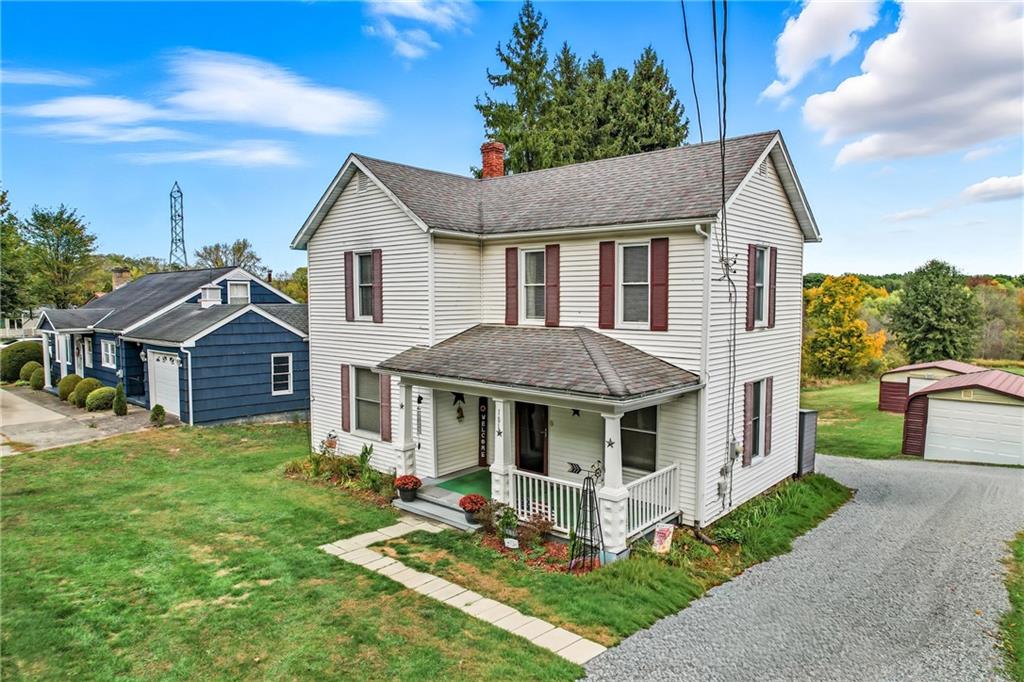 181 West Jamestown Road Greenville, PA 16125 - Photo 2 of 49 a front view of a house with a yard table and chairs