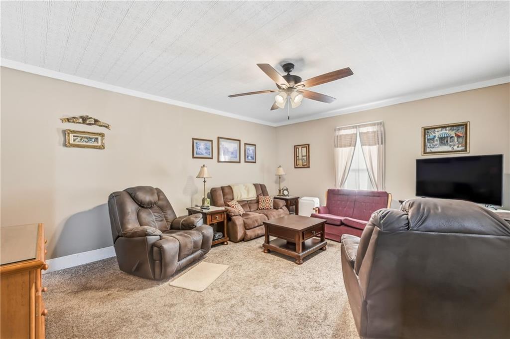 181 West Jamestown Road Greenville, PA 16125 - Photo 21 of 49 a living room with furniture ceiling fan and a window