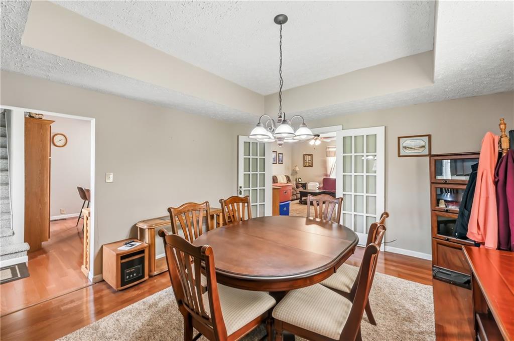 181 West Jamestown Road Greenville, PA 16125 - Photo 25 of 49 a view of a dining room with furniture wooden floor and chandelier