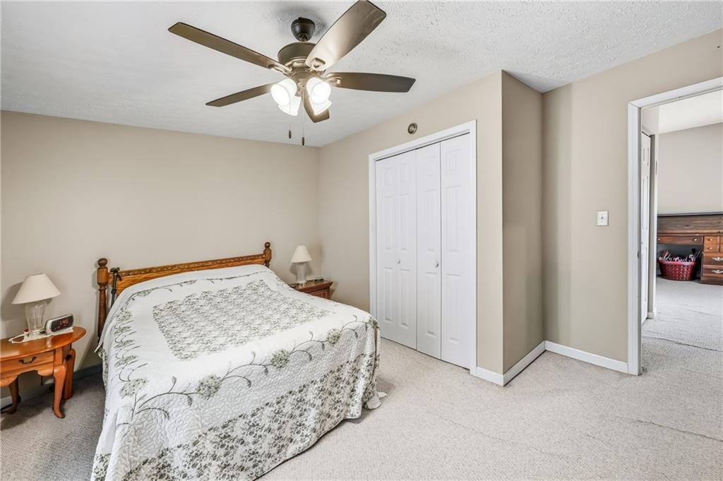 181 West Jamestown Road Greenville, PA 16125 - Photo 36 of 49 a bedroom with a bed and a chandelier