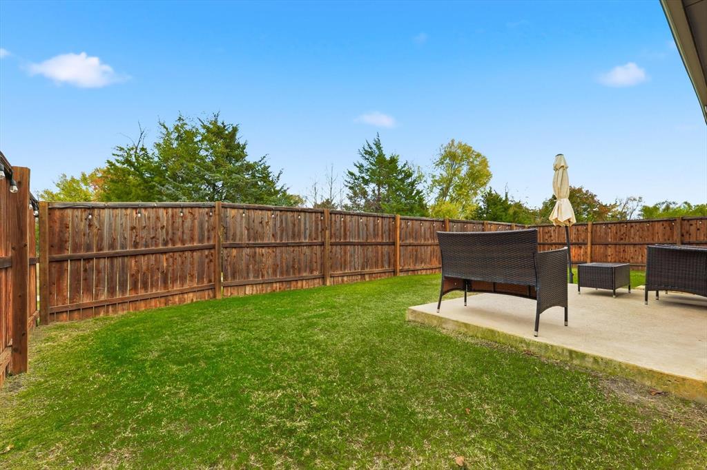 5582 Yarborough Drive Forney, TX 75126 - Photo 20 of 29 a garden with wooden fence