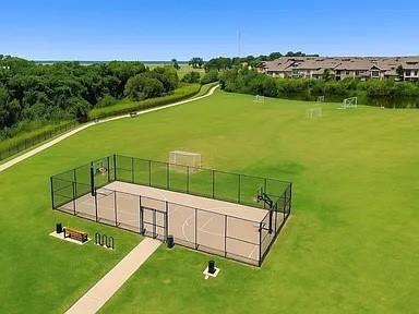 5582 Yarborough Drive Forney, TX 75126 - Photo 26 of 29 a view of a swimming pool with an outdoor space and seating area