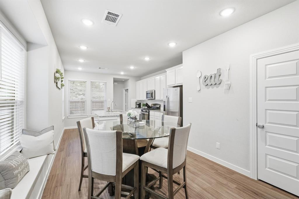 5582 Yarborough Drive Forney, TX 75126 - Photo 6 of 29 a view of a dining room with furniture window and wooden floor