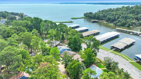 an aerial view of a house with a lake view