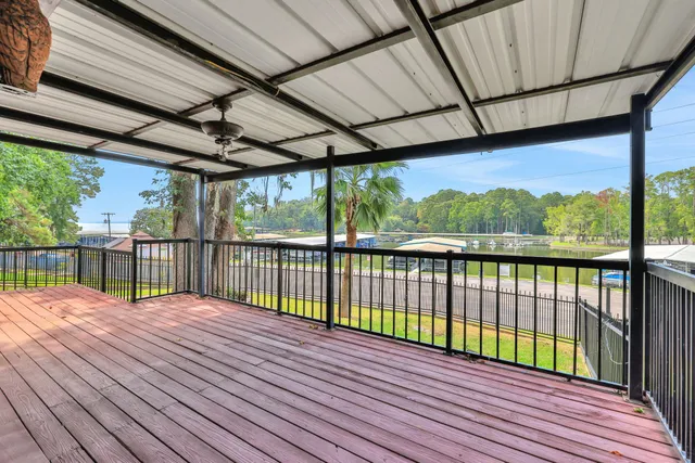 a large bed sitting in a living room next to a window
