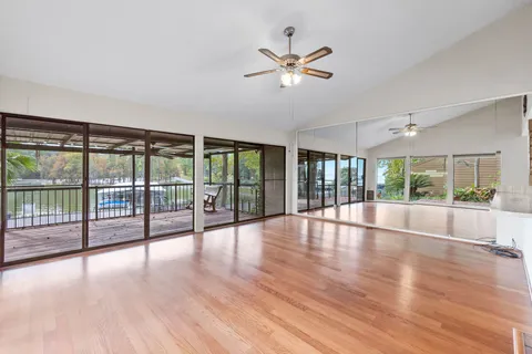 a view of an entryway with wooden floor
