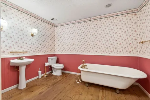 a view of an entryway with wooden floor