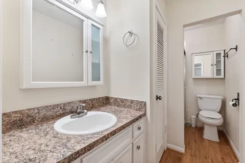 a utility room with cabinets washer and dryer
