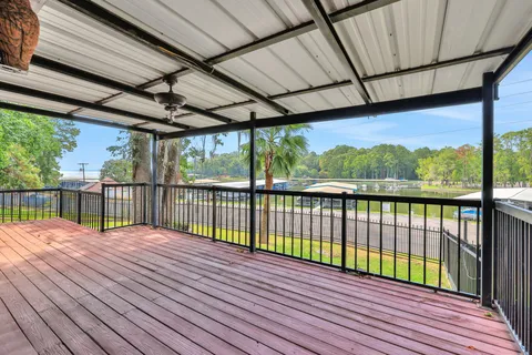 a view of balcony with wooden floor