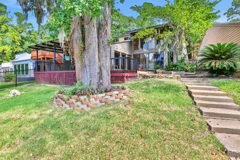 a view of backyard with a garden and outdoor seating