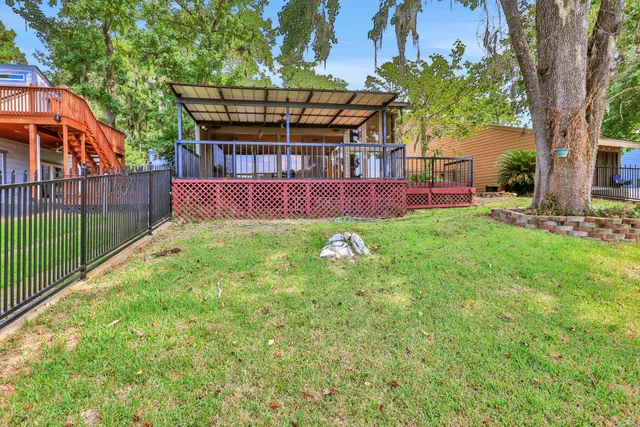 a backyard of a house with lots of green space