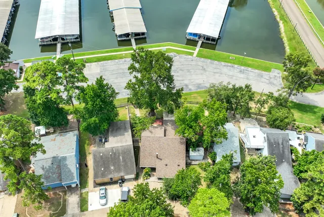 an aerial view of a house with a yard and garden