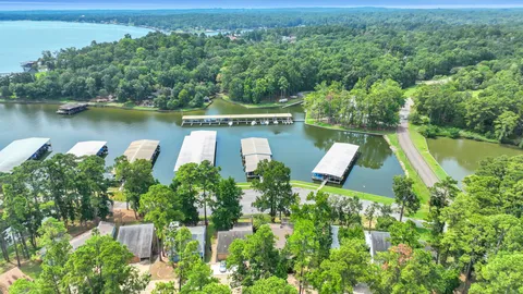 an aerial view of a house with a lake view