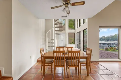 a kitchen with stainless steel appliances granite countertop a stove top oven a sink a counter space and cabinets