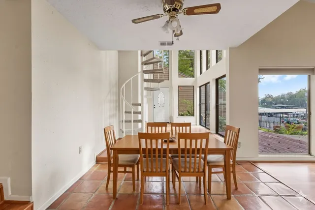 a kitchen with stainless steel appliances granite countertop a stove top oven a sink a counter space and cabinets