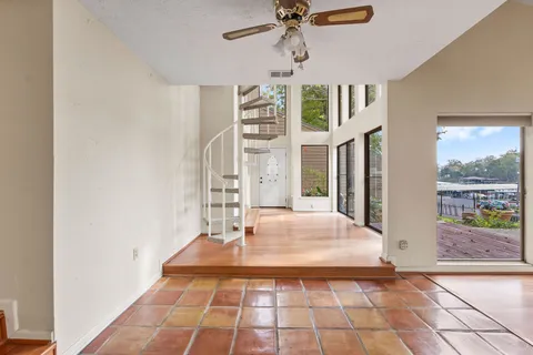 a very nice looking room with a large window and chandelier