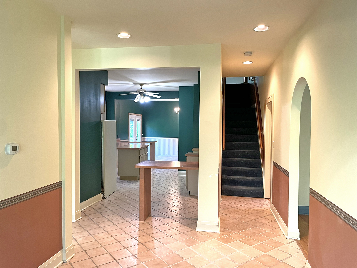 8914 Mason Hill Road Woodstock, IL 60098 - Photo 12 of 26 a view of a hallway with wooden floor and staircase