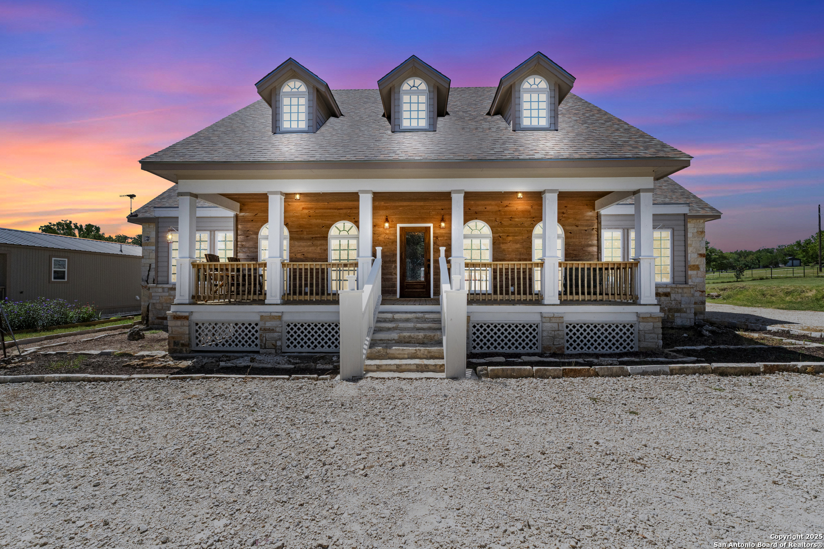 7040 Old Spring Branch Road Spring Branch, TX 78070 - Photo 1 of 43 a front view of a house with glass windows