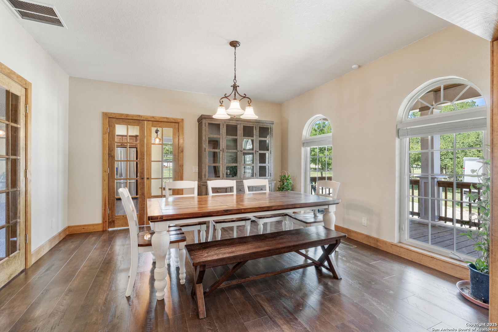 7040 Old Spring Branch Road Spring Branch, TX 78070 - Photo 13 of 43 a view of a room with wooden floor windows and outdoor view