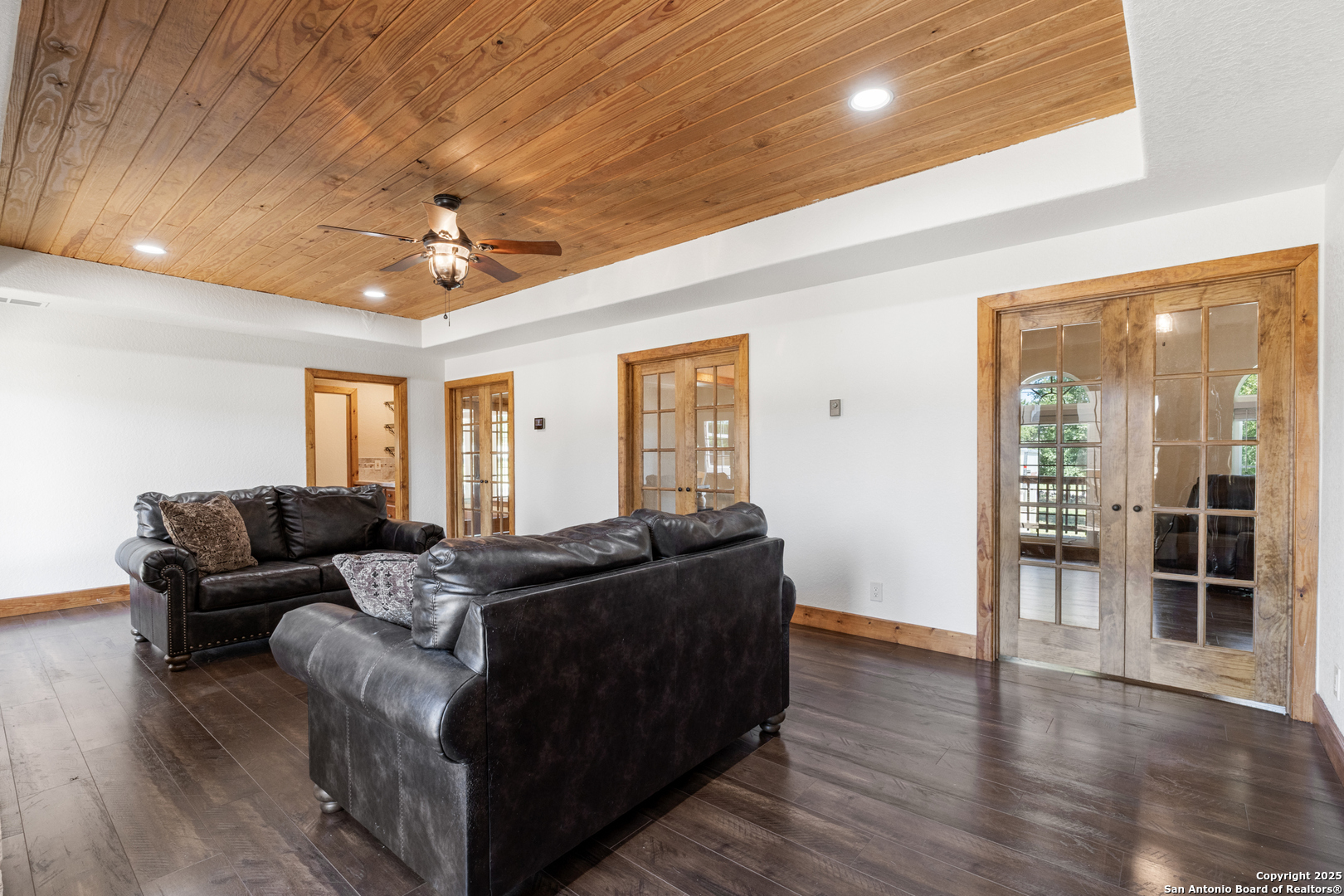 7040 Old Spring Branch Road Spring Branch, TX 78070 - Photo 14 of 43 a living room with furniture and wooden floor