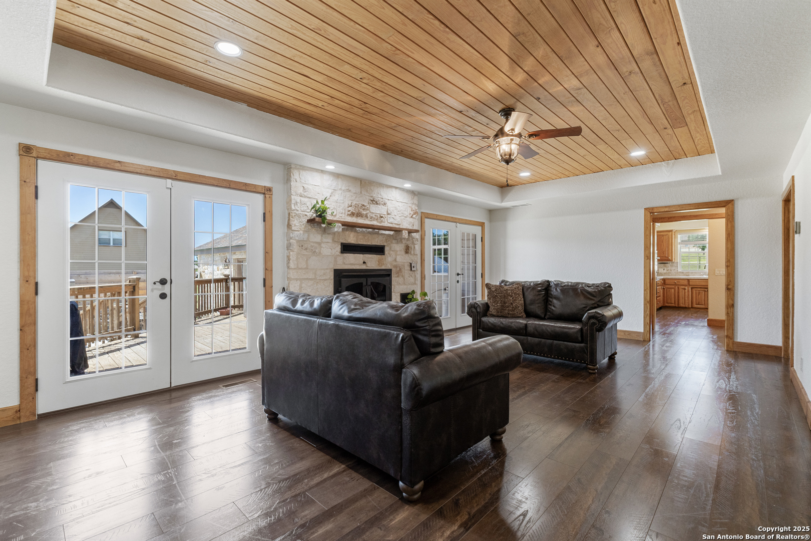 7040 Old Spring Branch Road Spring Branch, TX 78070 - Photo 15 of 43 a living room with furniture and a fireplace