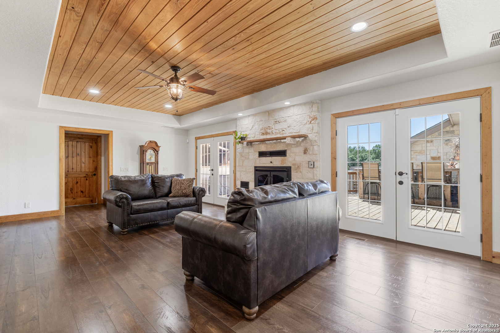 7040 Old Spring Branch Road Spring Branch, TX 78070 - Photo 16 of 43 a living room with furniture and wooden floor
