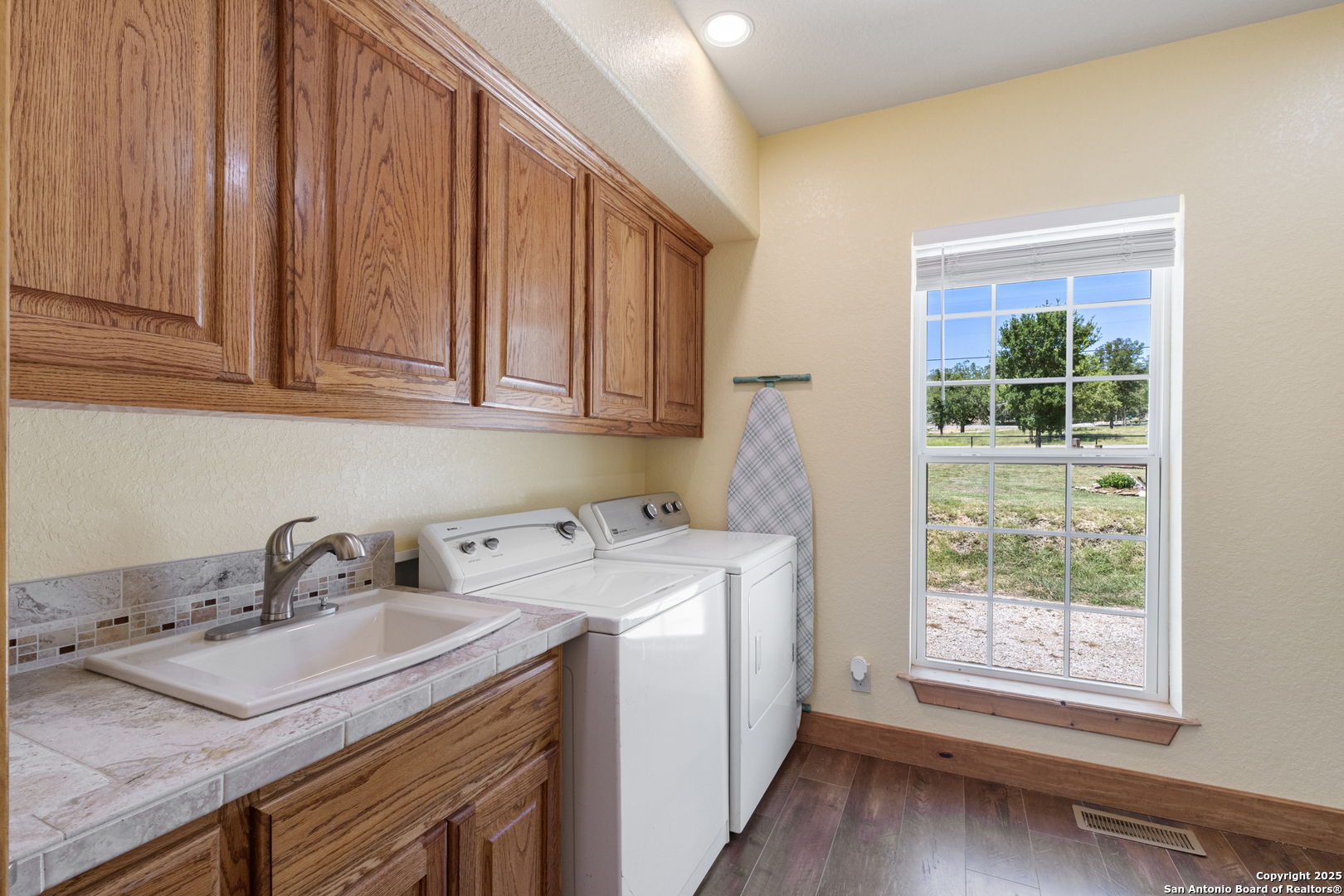 7040 Old Spring Branch Road Spring Branch, TX 78070 - Photo 20 of 43 a utility room with a sink washer and dryer