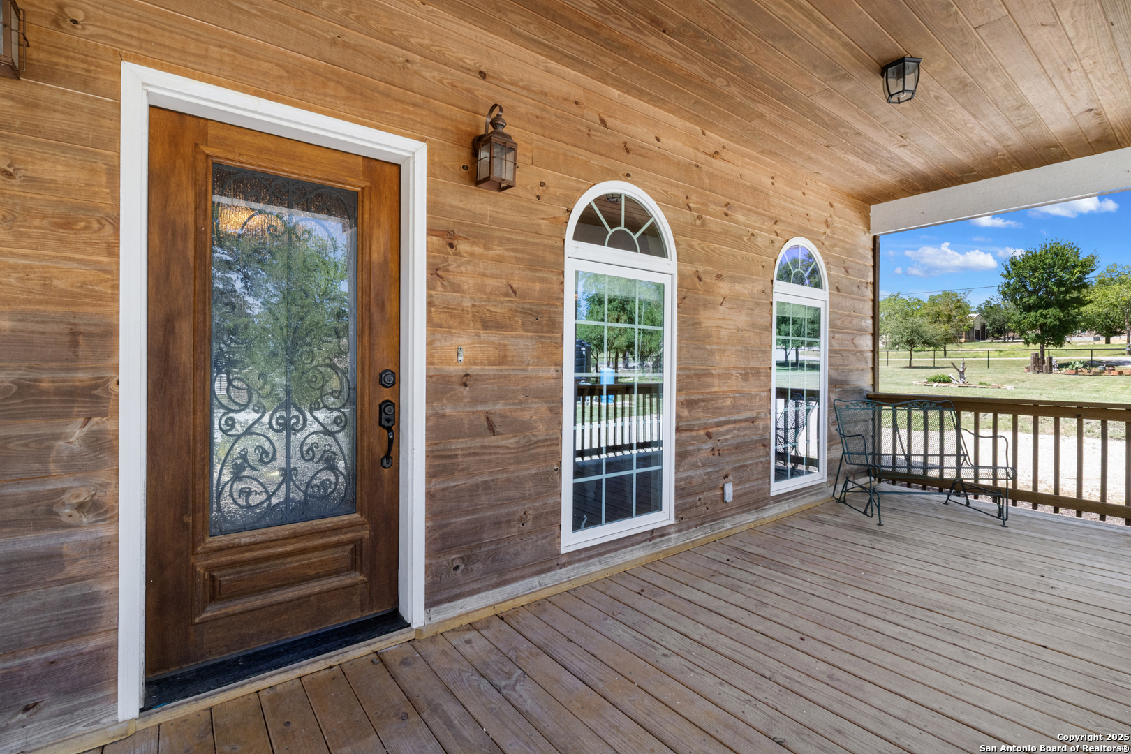 7040 Old Spring Branch Road Spring Branch, TX 78070 - Photo 2 of 43 a view of outdoor space with wooden floor and windows