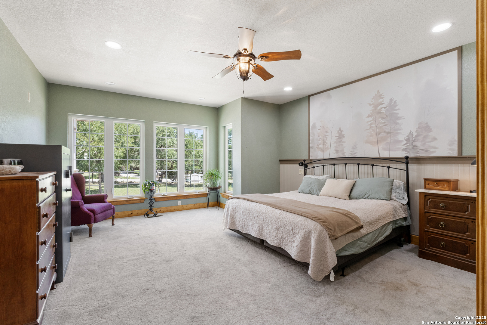 7040 Old Spring Branch Road Spring Branch, TX 78070 - Photo 21 of 43 a spacious bedroom with a bed and a large window