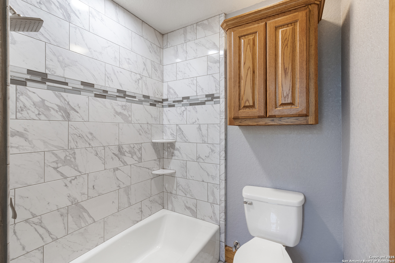 7040 Old Spring Branch Road Spring Branch, TX 78070 - Photo 29 of 43 a bathroom with a toilet a sink and bathtub